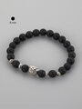 Krásný masivní náramek z korálků černého lávového kamene o průměru 0,8 cm a sovičkou