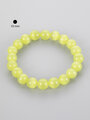 Jemný náramek z korálků barveného limetkově žlutého ulexitu kočičího oka, velikost korálků 1 cm