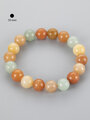 Atraktivní náramek z různobarevných korálků kalcitu, velikost kuliček 10 mm
