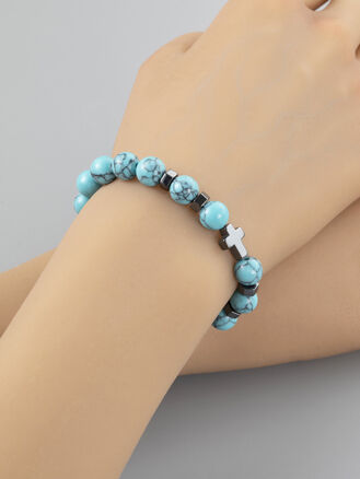 Krásný náramek z korálků tyrkenitu a křížkem z hematitu o průměru 0,8 cm