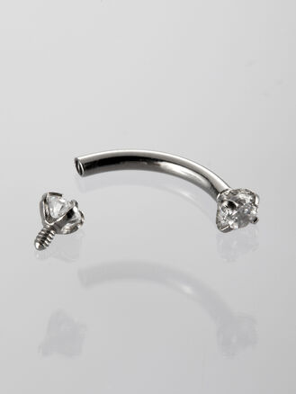 Banánek piercing do obočí s čirými krystaly z chirurgické oceli 