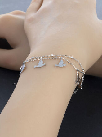 Krásný dvojitý náramek z chirurgické oceli s drobnými holubičkami a kuličkami