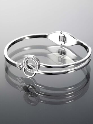 Elegantní pevný náramek z chirurgické oceli zdobený kolečkem se třpytivými krystaly