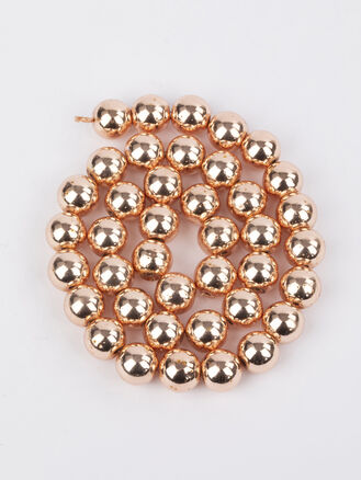 Korálková šňůra z kovově lesklých kuliček hematitu syntetického pokoveného, velikost korálků 10 mm