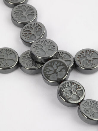 Korálková šňůra z kovově lesklých placiček hematitu s motivem strom života, rozměry cca 8 x 2 mm