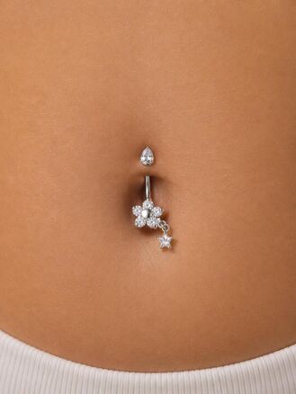Banánek piercing do pupíku s kuličkou, květem a přívěskem s krystalky, vyroben z chirurgické oceli